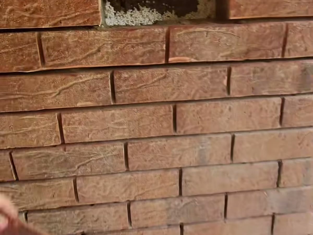 Brickwork opened up above an opening ready for repair